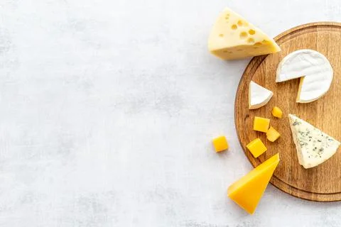 Layout of various types of cheese. Dairy products flat lay Stock Photos