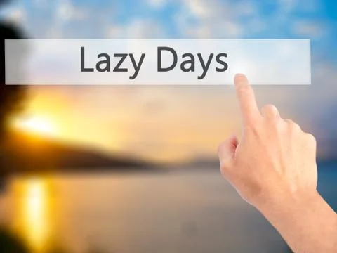 Lazy Days - Hand pressing a button on blurred background concept . Business,  Stock Photos