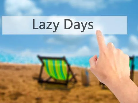 Lazy Days - Hand pressing a button on blurred background concept . Business,  Stock Photos