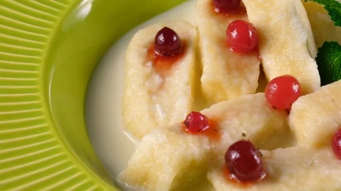 Lazy dumplings with cranberries, close-up view, loop Stock Footage 91033096