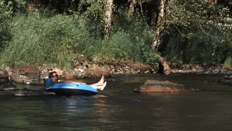 Lazy River Floating Man Stock Footage 91305319