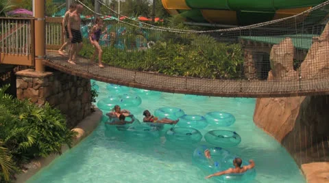 Lazy River at Water park Flowing Under Bridge Video stock 25899340