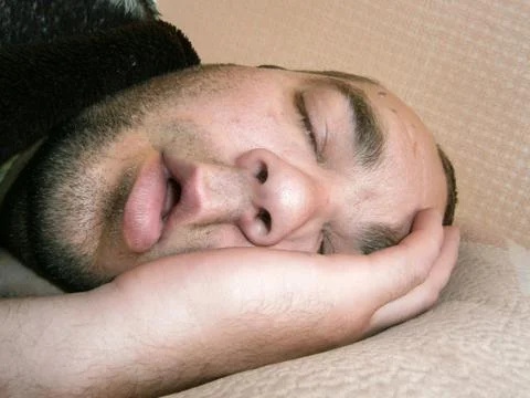 Lazy sleeping man Stock Photos