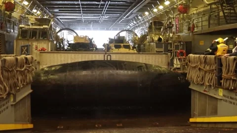 LCAC leaving well deck of U.S. Navy amphibious transport dock USS Green Bay Stock Footage 267680274