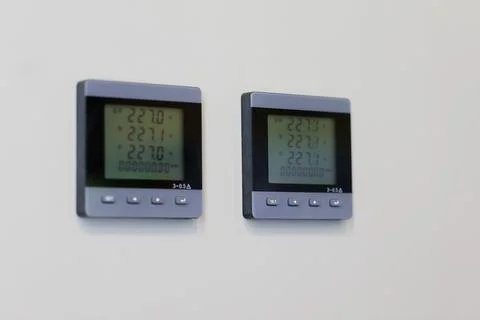 LCD digital AC voltmeters on a control panel Stock Photos