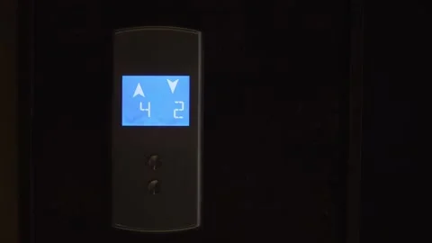 LCD display with blue illumination of elevator shows arrows and numbers. Stock Footage 185873155