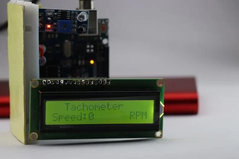 LCD module displaying tachometer project with speed and rpm units Fotos de archivo