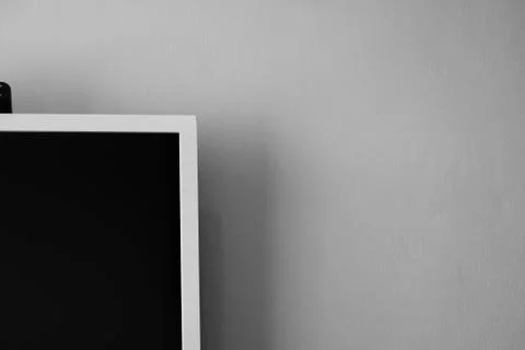 LCD or LED tv screen hanging on the wall with a tv tuner in room for interior Stock Photos