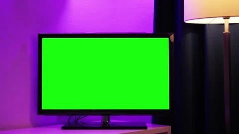 LCD smart TV screen with a green background on a wall background in the living Stock Footage 335774071