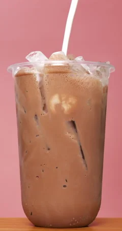 Chocolate milk poured into a glass