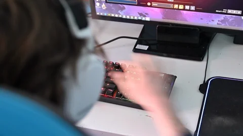 LD Backlit keyboard synchronising with the game played on the computer Stock Footage 127597068