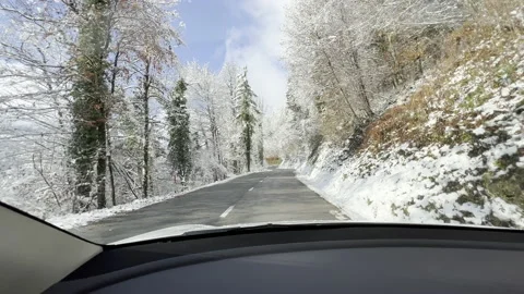 LD Driving a car up a road on a nice winter dar Stock Footage 225684516