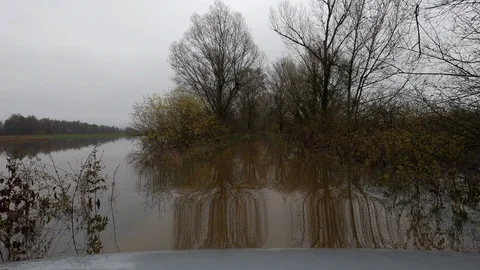LD Driving through the water of a completely flooded country road Stock Footage 120023847
