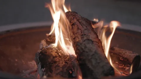 LD Fire burning in a fire bowl in the garden Stock Footage 203903869
