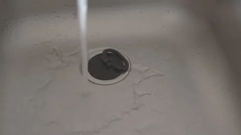 LD Male hand plugging the kitchen sink and filling it with water Stock Footage 264812613