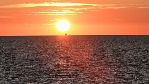 LD Orange sun setting over the sea Stock Footage 125854755