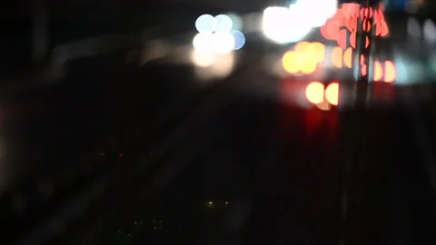 LD Out of focus: Lights of the highway traffic at night Stock Footage 123648075