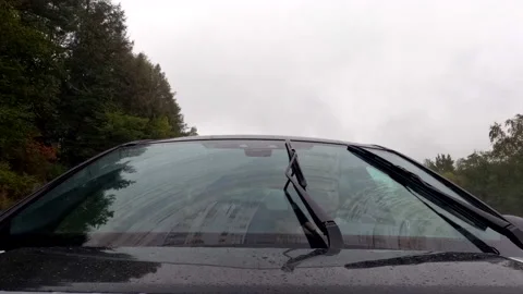 LD TIMELAPSE Screen wipers cleaning the windshield of the car driving on a road Stock Footage 214035472
