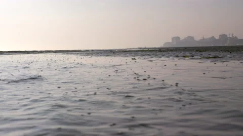LD Waves licking the sandy beach at sunset Stock Footage 233991275