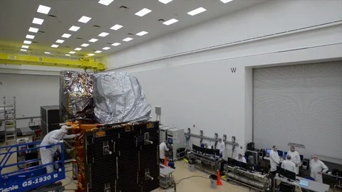 LDCM spacecraft being assembled in the cleanroom at Orbital Sciences Corp - 2013 Stock Footage 112273507