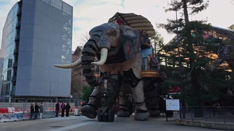 Le Grand Éléphant walking at Parc des Chantiers square beside HAB Galerie Vidéo 331407925