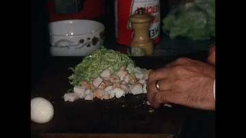 At le Grand Vefour restaurant chef chops crab meat in the kitchen, Paris, 1970 Stock Footage 85875588