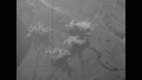 LE LUDE - 1944 - B-26 planes drop bombs that explode over Le Lude, France. Stock Footage 296689333