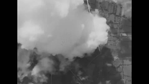 LE LUDE - 1944 - B-26 planes drop bombs that explode over Le Lude, France. Stock Footage 296689733