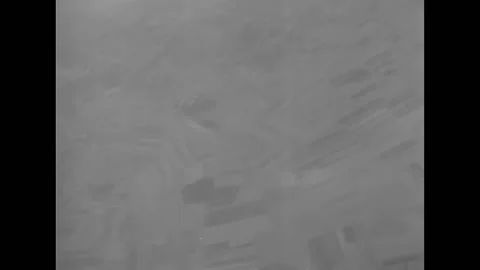 LE LUDE - 1944 - Bombs explode, and a crew member tosses white markers from a Stock Footage 296695880