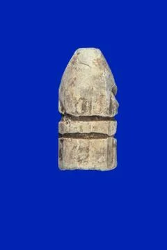 Lead bullet, on a blue background Stock Photos
