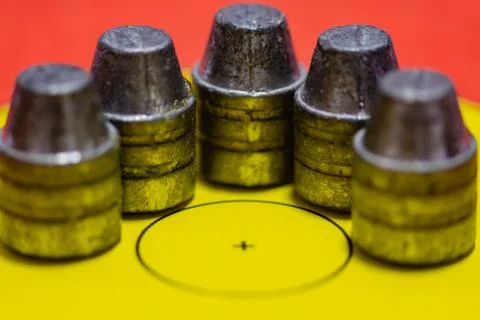 Lead bullets on a target face Stock Photos