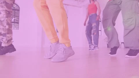 Lead dancer starting weight shift, dance quartet rehearsing steps in sync, pink Stock Footage 333925411