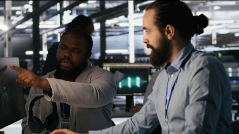 Lead data center engineer overseeing team integrating AI automation tools Stock Footage 309628594