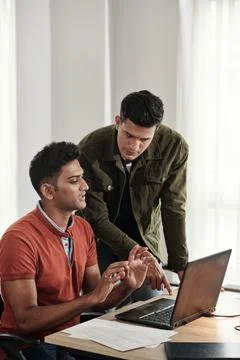 Lead Developer Guiding Colleague Stock Photos