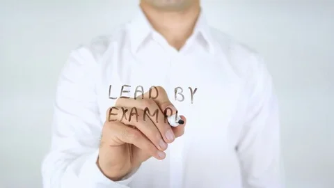 Lead by Example, Man Writing on Glass Stock Footage 77903396