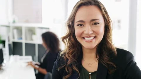 Lead by example. Portrait of a confident young businesswoman working in a modern Stock Photos