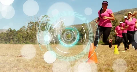 Lead female runner nearing and passing orange cone at drill start, HUD overlay Stock Footage 330188829