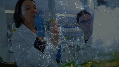 Lead female scientist speaking, lifting vial and showing lab steps, network Stock Footage 335761903