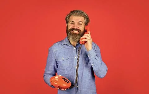 Lead generation specialist. Sales script. Bearded man phone conversation. Retro Stock Photos