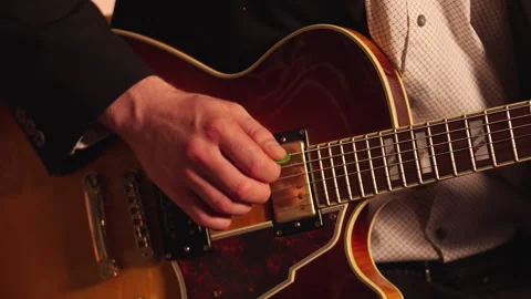 Lead Guitarist Using Peak Guitar And Tapping Technique During Performance Stock Footage 325023254