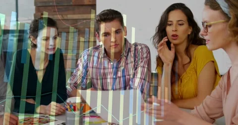 Lead holding print and pointing laptop as creative team checking layouts, Stock Footage 330936401