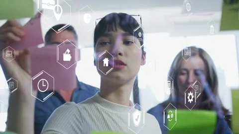Lead initiating planning, placing pink notes on glass, hex UI interacting, Stock Footage 333704249