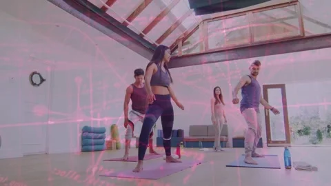 Lead instructor initiating step, class matching on mats for fitness warmup, Stock Footage 333211155