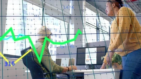 Lead leaning and pointing, analyst seated checking data, tech chart grid Stock Footage 332704688