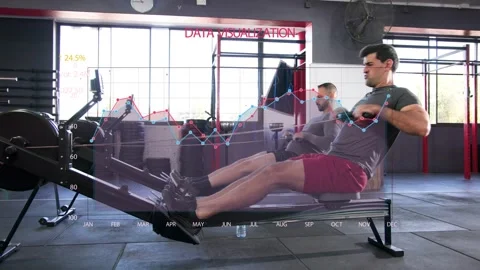 Lead man pulling handle, rowing on erg as partner joins, animated chart overlay Stock Footage 334242286