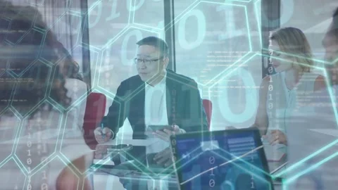 Lead man tapping tablet, noting, pointing at laptop, activating hex binary Video stock 333449440
