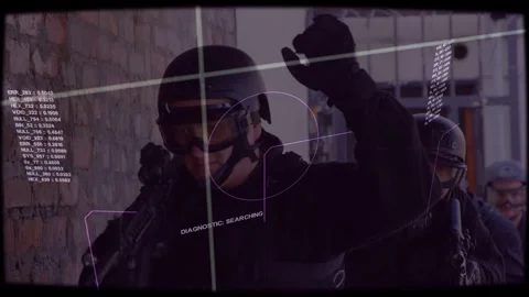 Lead operator shouldering rifle and initiating security sweep beside brick wall, Stock Footage 333774876