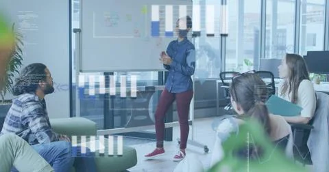 Lead pointing at board briefing animated bars code overlaying team asking 스톡 사진