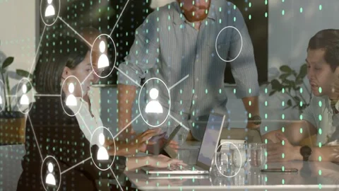 Lead pointing laptop starting network graph over screens while team tapping Stock Footage 333648367