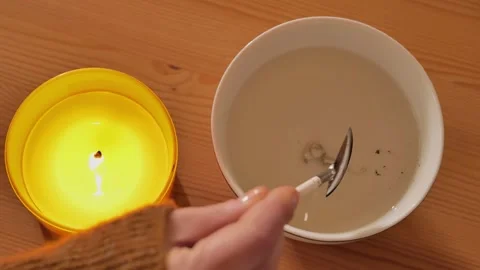 Lead pouring set for fortune telling.Hand pouring molten tin Stock Footage 288883090